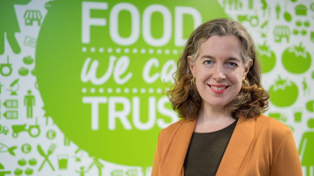 Emily Miles, Chief Executive of the Food Standards Agency, in front of Food We Can Trust sign