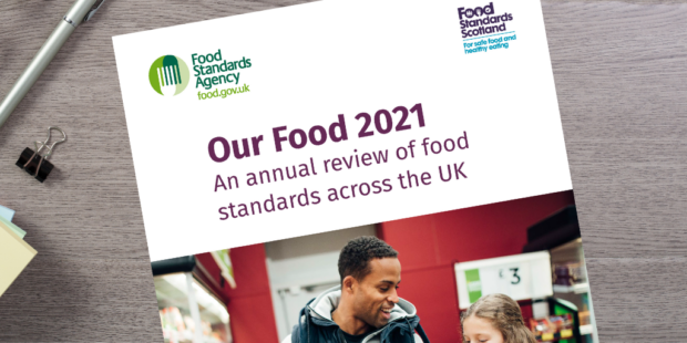 Front cover of print edition of 'Our Food: An annual review of food standards across the UK' on a table
