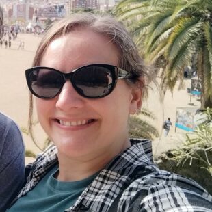 Dr Erica Kintz, Senior Microbiological Risk Assessor, in sunglasses near a beach