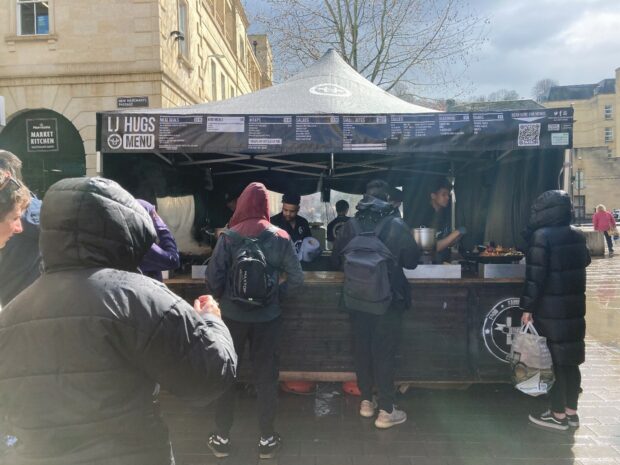 A lunchtime crowd gathers at the LJ Hugs food stall